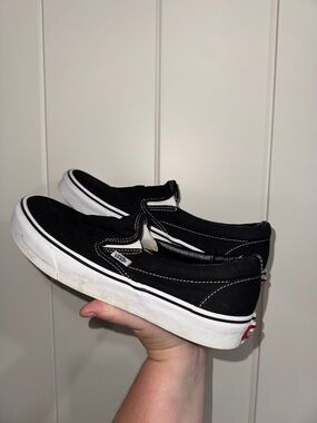 Vans Black and White Slip-On Sneakers